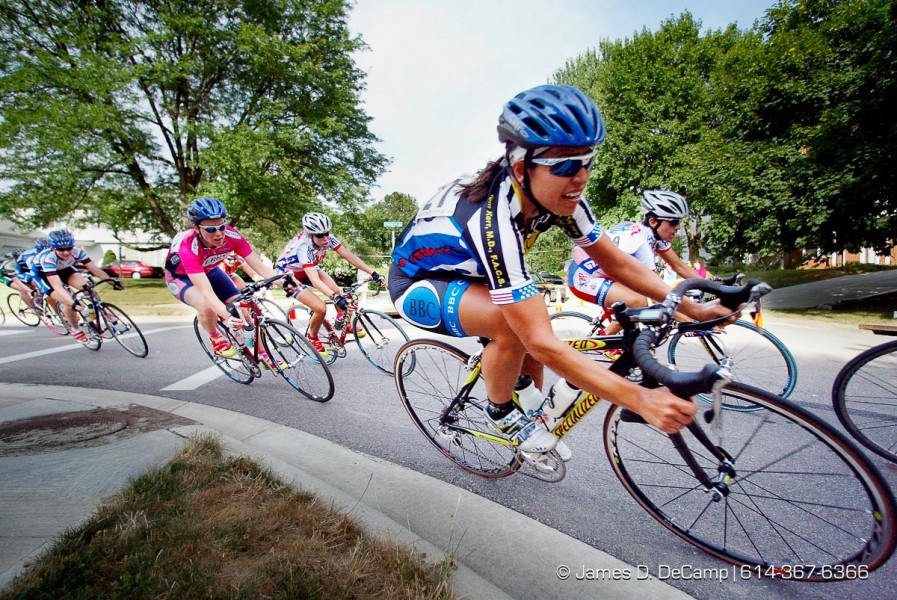 #27 Sherri Stedje, right, makes a turn onto Longfellow Avenue in Worthington in the final laps of the Wendy's International Sports Festival's Worthington Criterium held Friday July 5, 2002. (© James D. DeCamp 614-367-6366)