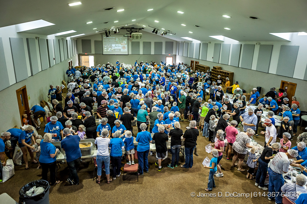 More than 350 volunteers pack an estimated 80,000 food bags at the Violet Baptist Church Sept. 29. The food bags will be distributed by the Stop Hunger Now organization to more than 70 different countries around the world. (© James D. DeCamp | http://www.JamesDeCamp.com | 614-367-6366)