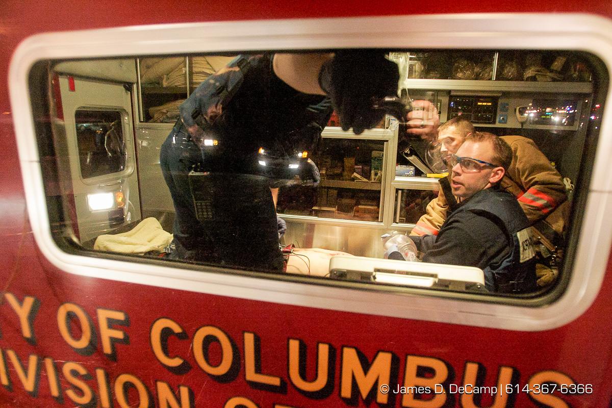 Columbus, Worthington & Clinton Twp Medics work on one of seven shooting victims at the Alrosa Villa, 5055 Sinclair Road late Wednesday night December 8, 2004. (© James D. DeCamp | http://www.JamesDeCamp.com | 614-367-6366)
