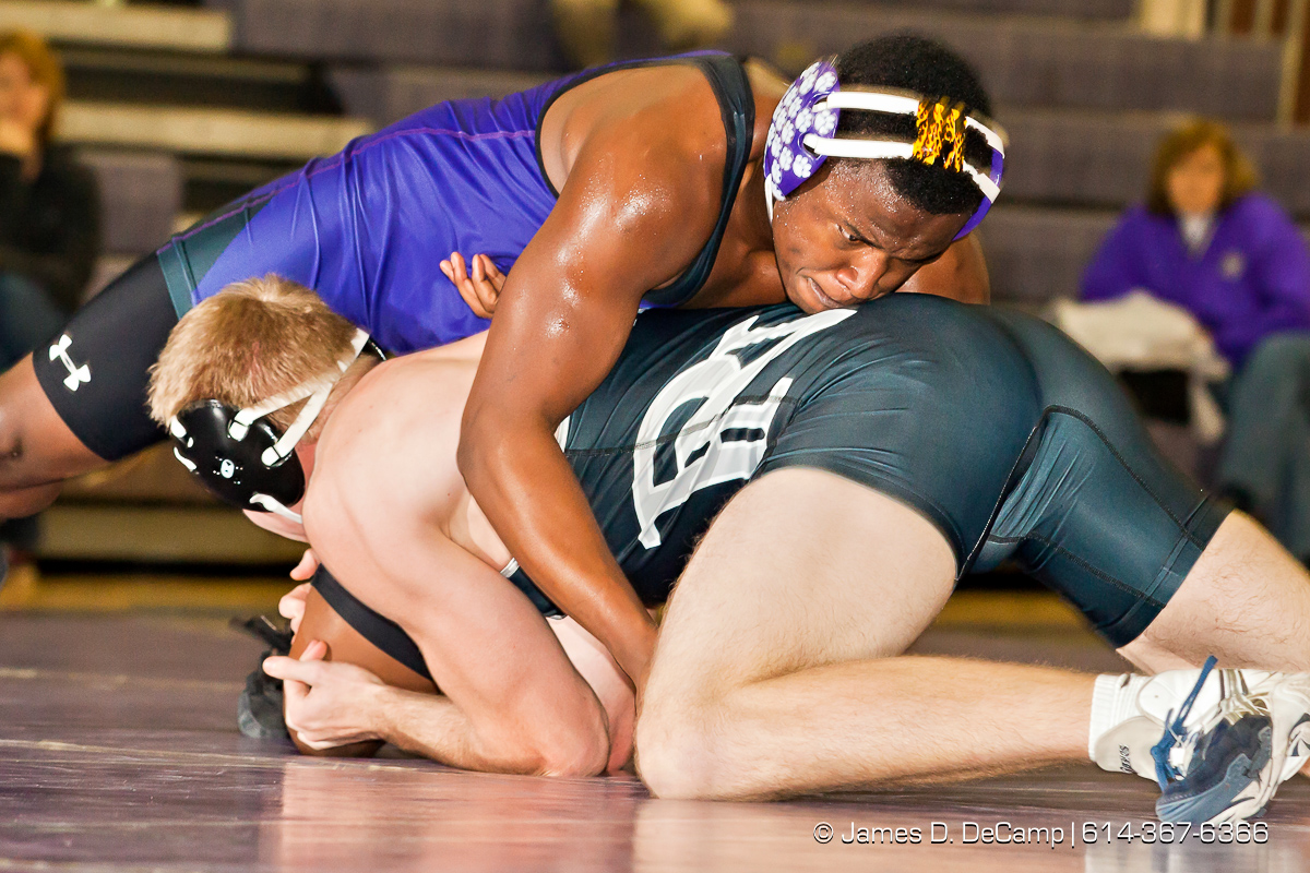 Pickerington North High School's Matt Kitchen wrestles with Pickerington Central High School's JJ Chowoe in the 195 lb. weight class Thursday evening February 2, 2012 at Pickerington North High School. (© James D. DeCamp | http://www.JamesDeCamp.com | 614-367-6366)