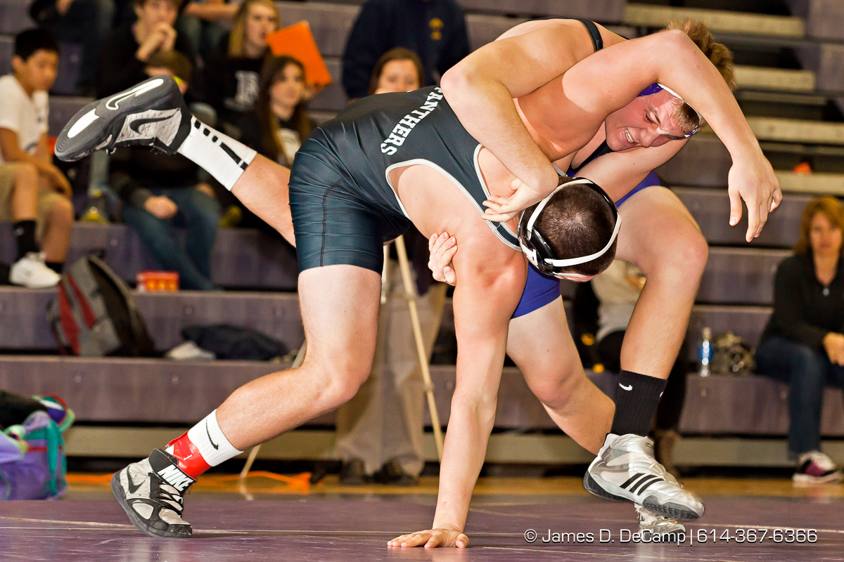 Pickerington North High School's Geno Rollo wrestles with Pickerington Central High School's Ryan Schmeltzer in the 220 lb. weight class Thursday evening February 2, 2012 at Pickerington North High School. (© James D. DeCamp | http://www.JamesDeCamp.com | 614-367-6366)