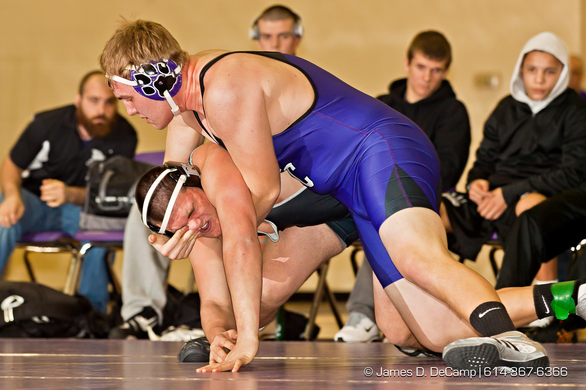 Pickerington North High School's Geno Rollo wrestles with Pickerington Central High School's Ryan Schmeltzer in the 220 lb. weight class Thursday evening February 2, 2012 at Pickerington North High School. (© James D. DeCamp | http://www.JamesDeCamp.com | 614-367-6366)