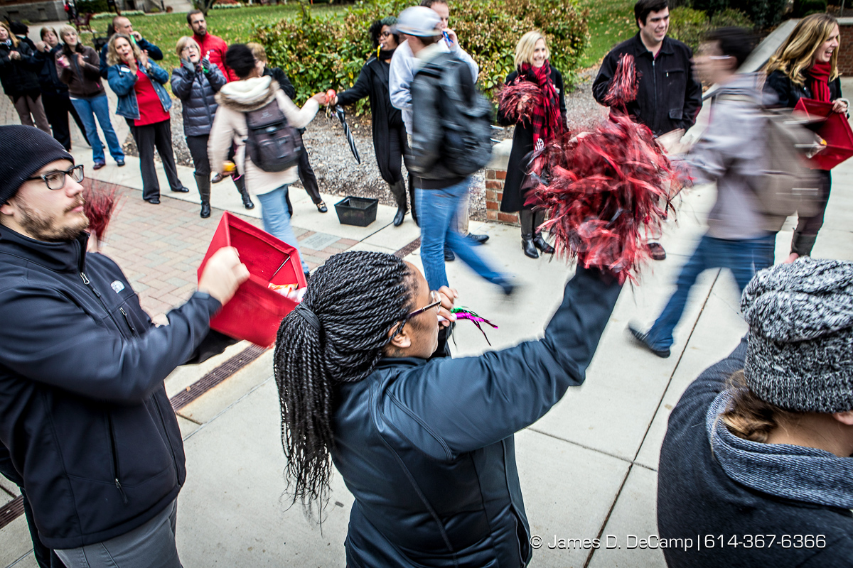 Ohio Wesleyan University's Residential Life Coordinator Dominique L. Aaron waves a pompom and blows a kazoo to welcome students to a "Finish Strong OWU"! event photographed Wednesday, October 26, 2016 at the Ohio Wesleyan University gate. (© James D. DeCamp | http://JamesDeCamp.com | 614-367-6366)