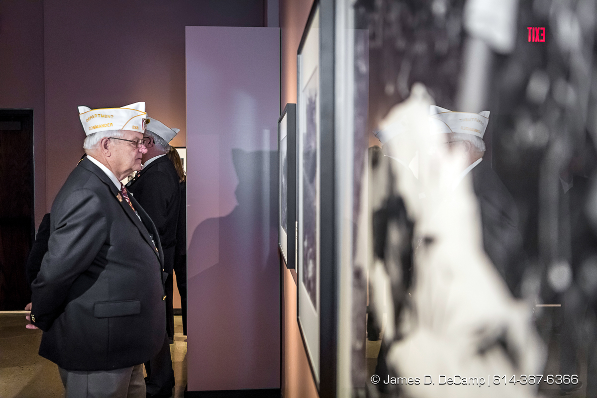 The ribbon cutting of The Forgotten War, Korea 1950, Photographs by Max Desfor photographed Friday, November 11, 2016 at the Ohio History Center. The Ohio History Center has the honor of presenting, for the first time ever in the United States, THE FORGOTTEN WAR, Korea 1950, Photographs by Max Desfor. The extraordinary exhibit of Korean War photographs taken by Pulitzer Prize-winning Associated Press photographer Max Desfor who spent three turbulent years in Korea from 1950–1953. He captured the people’s plight and the American soldiers’ defense. The exhibit features 36 photographs printed from original material culled from Desfor’s personal collection and his 1950 winning submission to the Pulitzer Prize Committee. Curated and produced by Cyma Rubin. Sponsored and presented by Business of Entertainment Inc., New York. Local funding provided by the Gordon Chandler Memorial Fund of The Columbus Foundation and Conestoga, a volunteer fundraising support group. (© James D. DeCamp | http://JamesDeCamp.com | 614-367-6366)