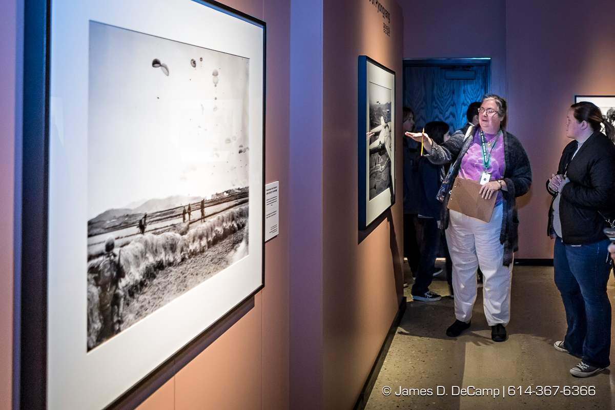 The ribbon cutting of The Forgotten War, Korea 1950, Photographs by Max Desfor photographed Friday, November 11, 2016 at the Ohio History Center. The Ohio History Center has the honor of presenting, for the first time ever in the United States, THE FORGOTTEN WAR, Korea 1950, Photographs by Max Desfor. The extraordinary exhibit of Korean War photographs taken by Pulitzer Prize-winning Associated Press photographer Max Desfor who spent three turbulent years in Korea from 1950–1953. He captured the people’s plight and the American soldiers’ defense. The exhibit features 36 photographs printed from original material culled from Desfor’s personal collection and his 1950 winning submission to the Pulitzer Prize Committee. Curated and produced by Cyma Rubin. Sponsored and presented by Business of Entertainment Inc., New York. Local funding provided by the Gordon Chandler Memorial Fund of The Columbus Foundation and Conestoga, a volunteer fundraising support group. (© James D. DeCamp | http://JamesDeCamp.com | 614-367-6366)