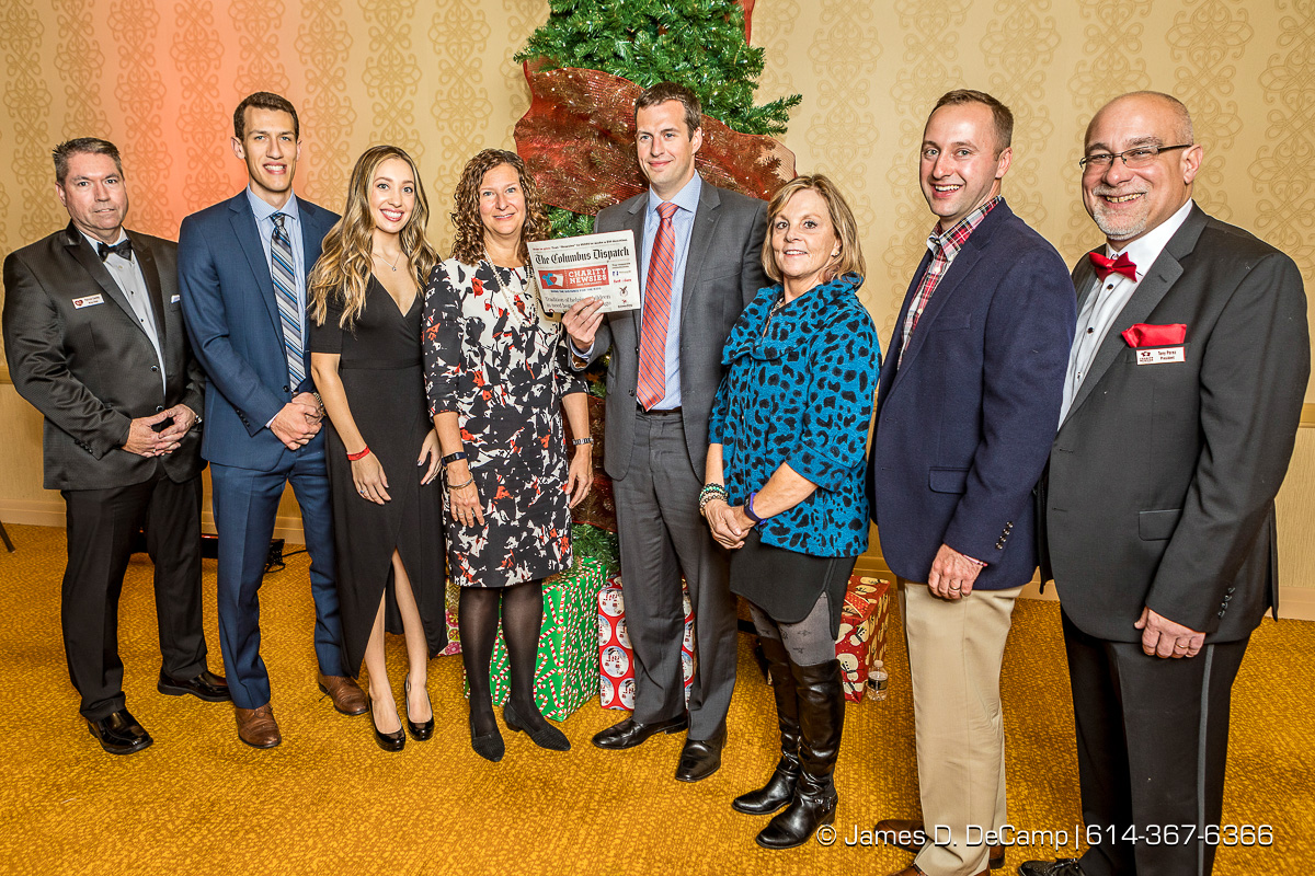 The third newspaper in the The 2017 Clothe-a-Child Gala and 110th annual Charity Newsies Newspaper Auction was sold to the Galvin Foundation: (l-r) Pat Conley, Michael Timm, Sarah Craycraft, Michelle Strohe, Dan Barnett, Joyce Waters, Dan Gusty and Tony Perez photographed Thursday, November 30, 2017 at the Hollywood Casino Ballroom. (© James D. DeCamp | http://JamesDeCamp.com | 614-367-6366)