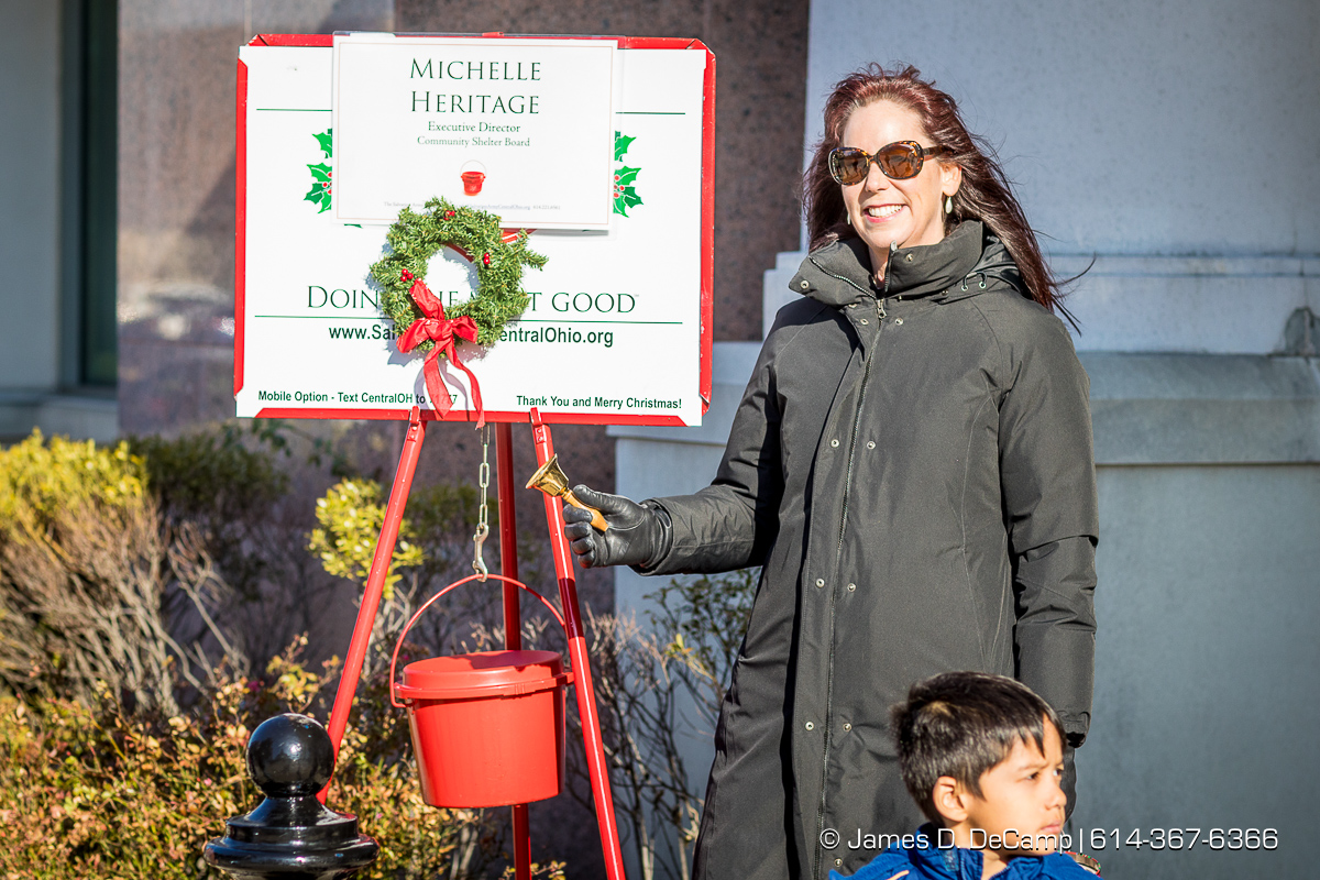 Michelle Heritage from the Community Shelter Board manning the Salvation Army station at the Easton Town Center photographed Saturday, December 16, 2017. (© James D. DeCamp | http://JamesDeCamp.com | 614-367-6366)
